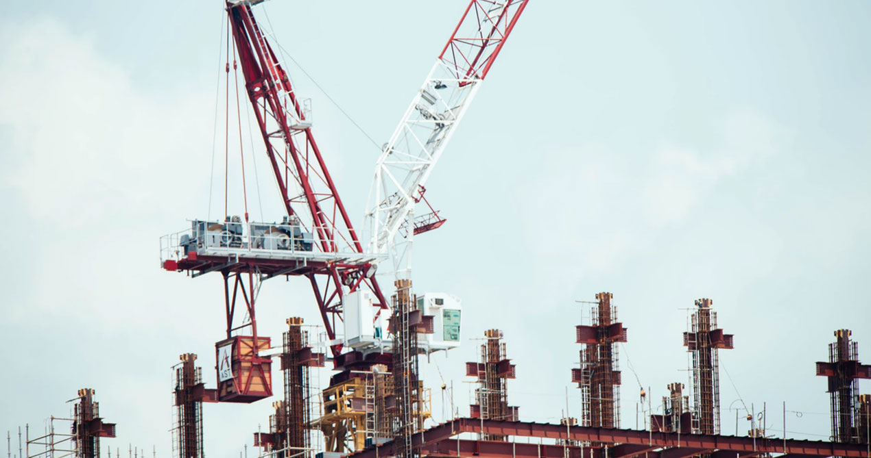 Construction site with crane and scaffolding.